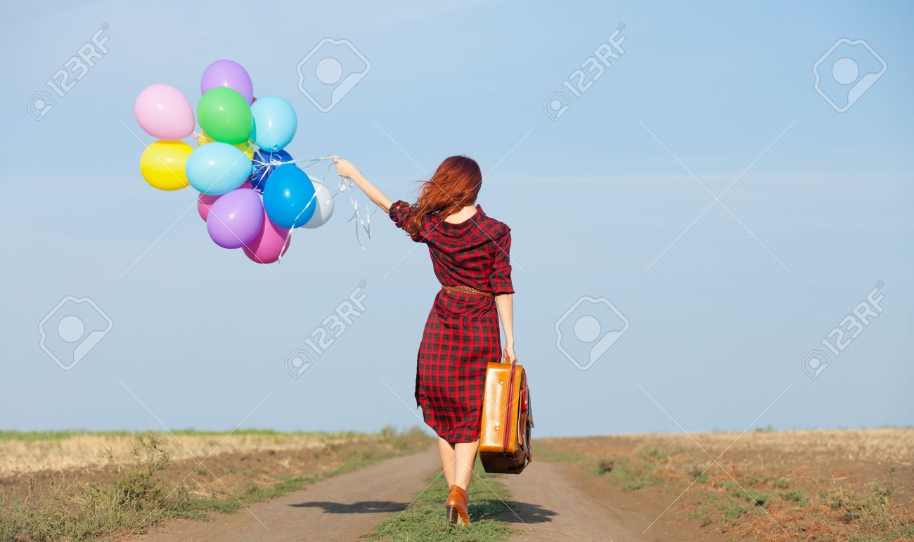 Beautiful girl in plaid dress with multicolored balloons and bag on countryside - 44352343 Beautiful girl in plaid dress with multicolored balloons and bag on countryside - 44352343