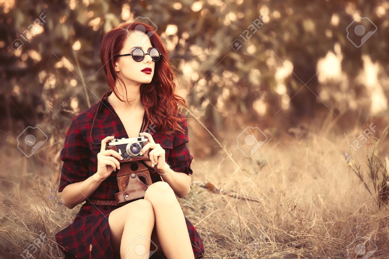 Beautiful girl in plaid dress retro camera and sunglasses at countryside - 44351768 Beautiful girl in plaid dress retro camera and sunglasses at countryside - 44351768