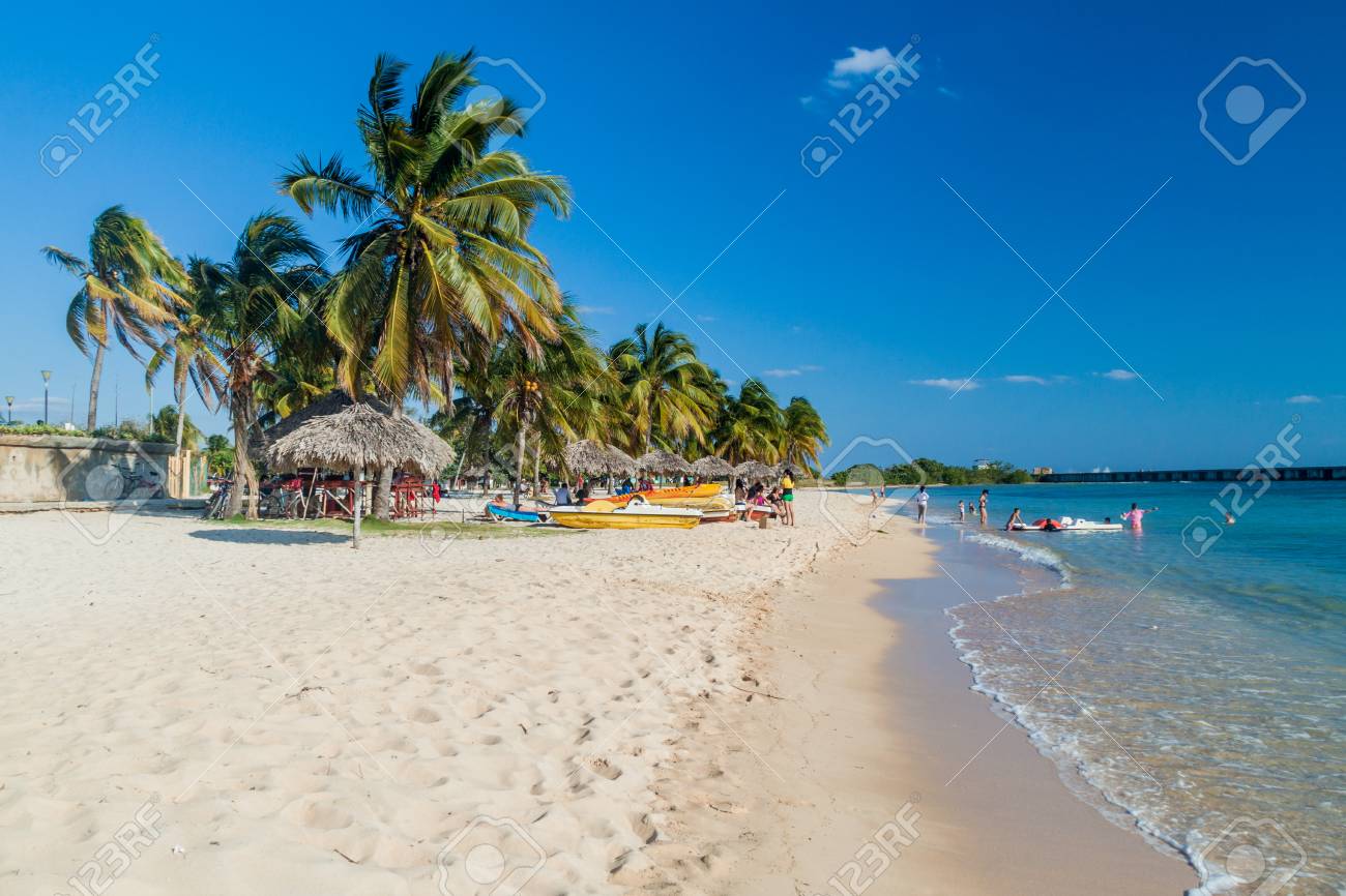 PLAYA GIRON, CUBA - FEB 14, 2016: Tourists at the beach Playa Giron, Cuba. This beach is famous for its role during the Bay of Pigs invasion. - 79334776 PLAYA GIRON, CUBA - FEB 14, 2016: Tourists at the beach Playa Giron, Cuba. This beach is famous for its role during the Bay of Pigs invasion. - 79334776