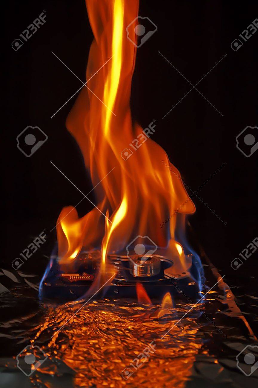 computer hard disk on fire burning in flames stock photo picture burning computer