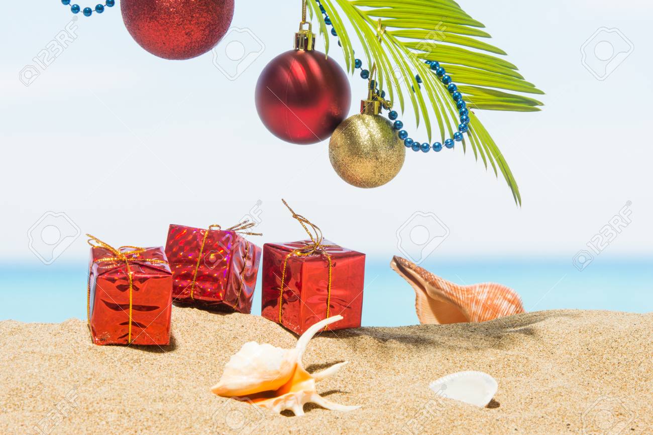 christmas tree decorations on the beach in tropical concept stock