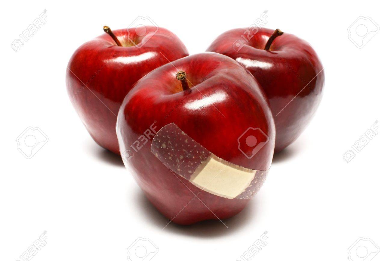 Injured apples with plaster on white background. - 3244144 Injured apples with plaster on white background. - 3244144