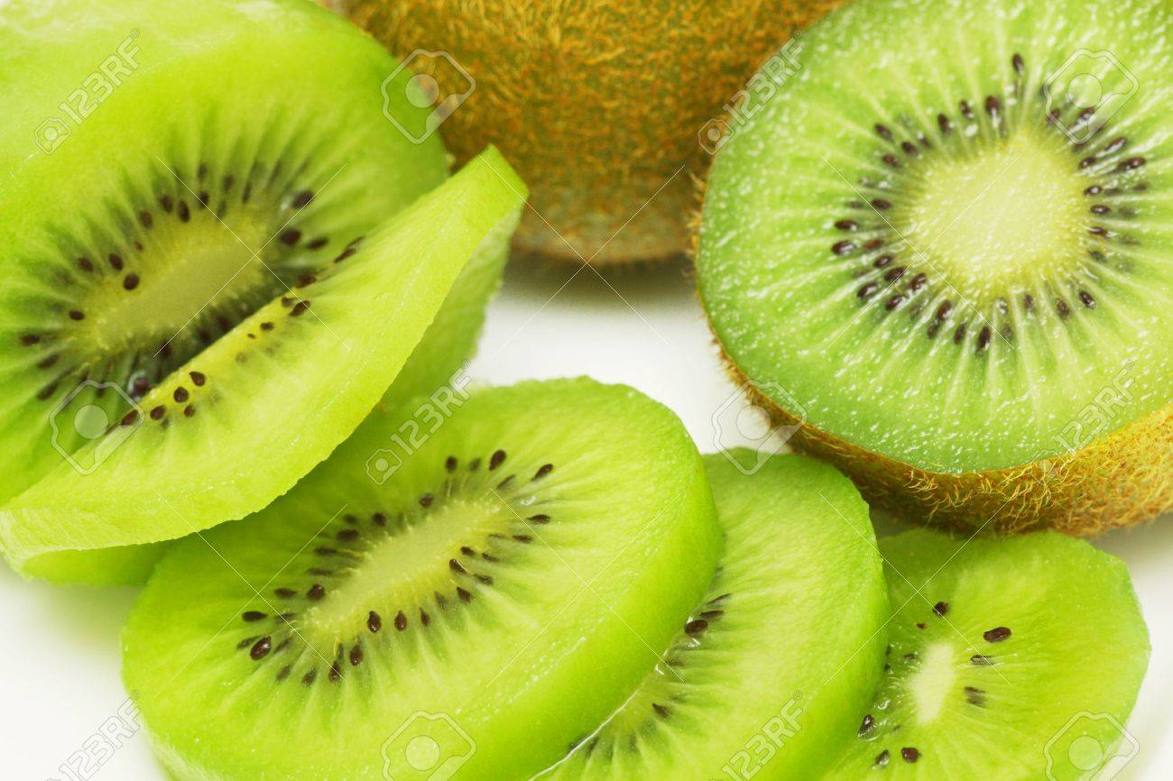 Kiwi fruit sliced into pieces on white background. - 3485562 Kiwi fruit sliced into pieces on white background. - 3485562