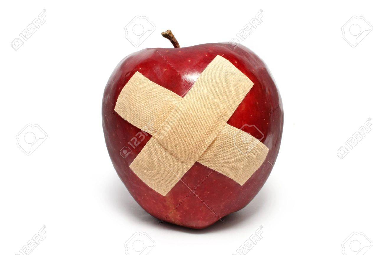 An injured red apple with plaster on it isolated over white background. - 7500774 An injured red apple with plaster on it isolated over white background. - 7500774