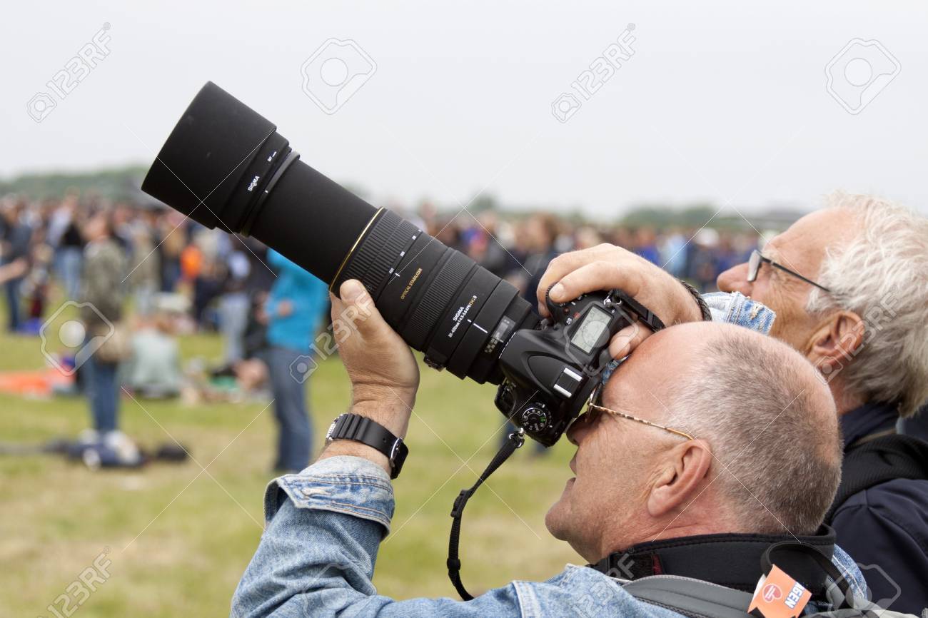 LEEUWARDEN, THE NETHERLANDS - JUNE 11 2016: Photographer with a Nikon camera and Sigma