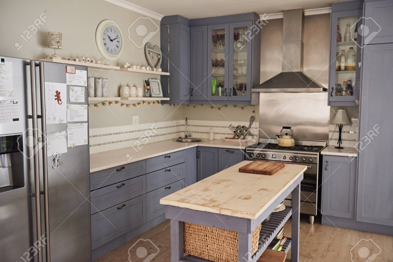 Country Style Kitchen With With An Island In A Home Stock Photo
