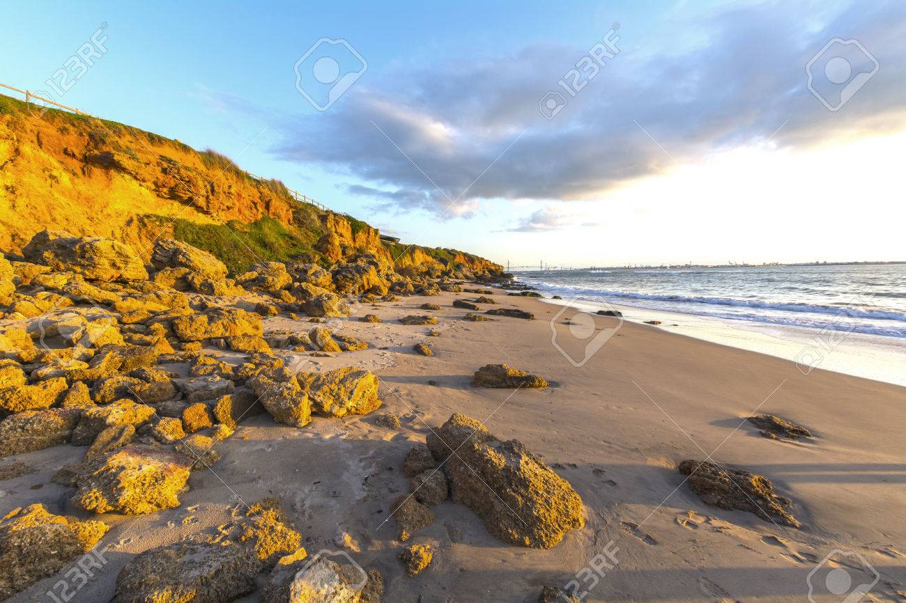 36625991-Landscape-of-rocky-beach-at-sunset-El-Buzo-beach-Vistahermosa-Puerto-de-Santa-Maria-Cadiz-Spain-Stock-Photo.jpg