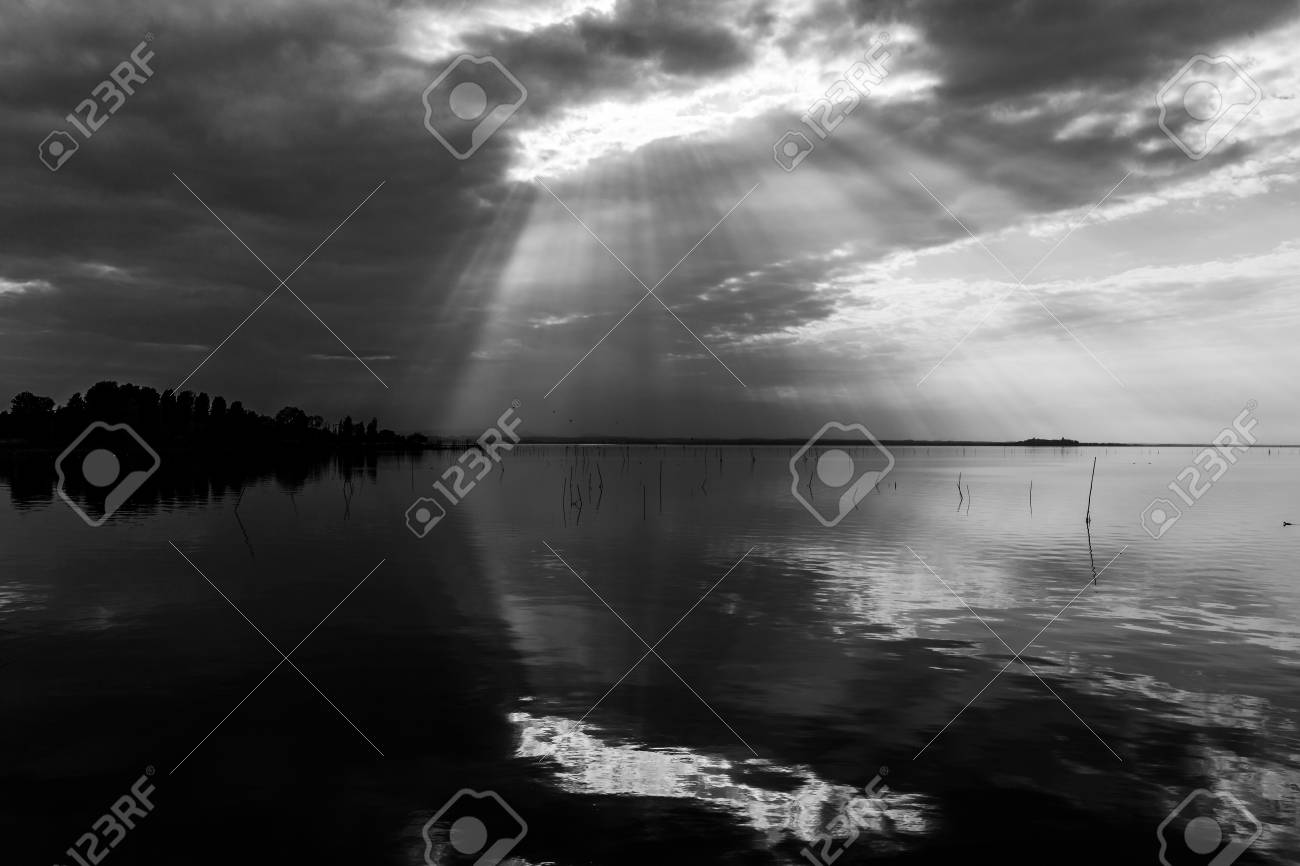perfectly symmetric and spectacular view of a lake with clouds sky