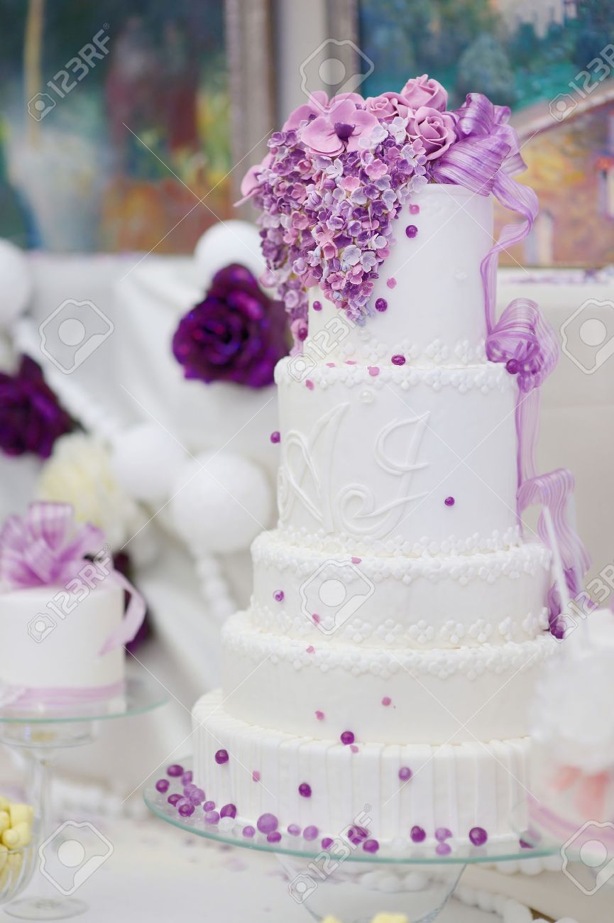 White Wedding Cake Decorated With Sugar Purple Flowers Stock Photo