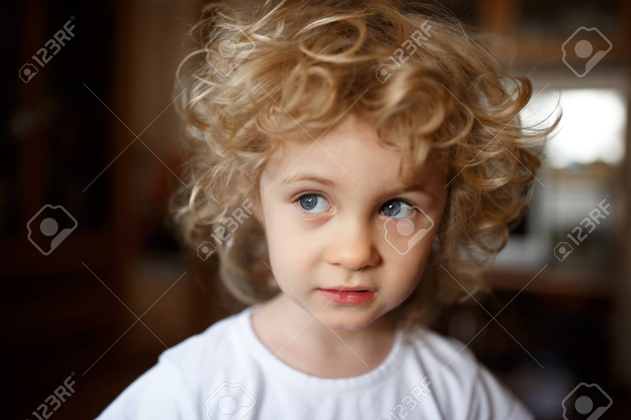 Portrait Of Adorable Little Blonde Girl With Curly Hair Stock Photo Picture And Royalty Free Image Image