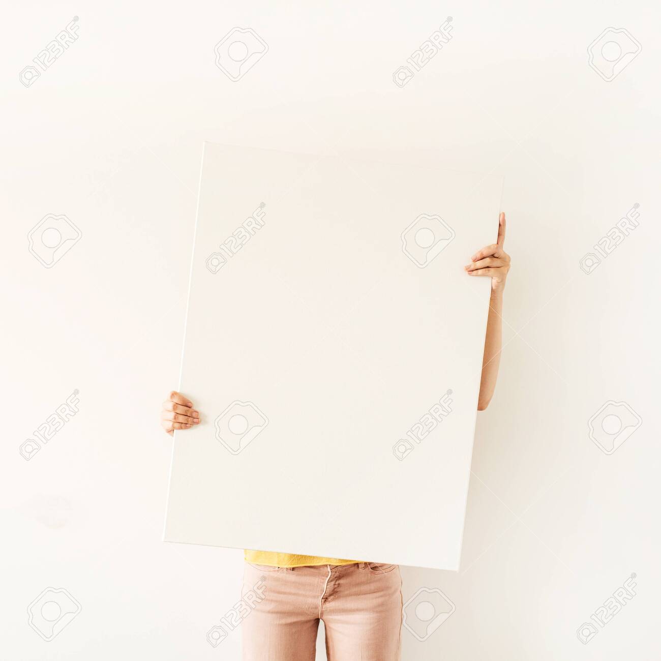 Download Young Pretty Woman Hold Blank Canvas With Empty Mockup Copy Space Stock Photo Picture And Royalty Free Image Image 136183828