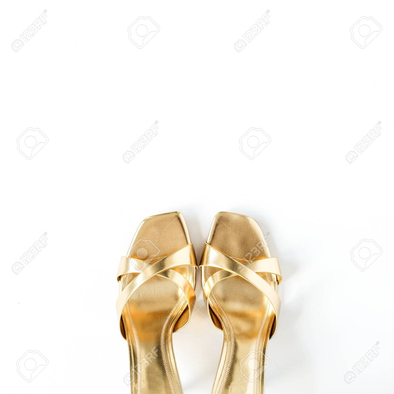 gold and white slippers