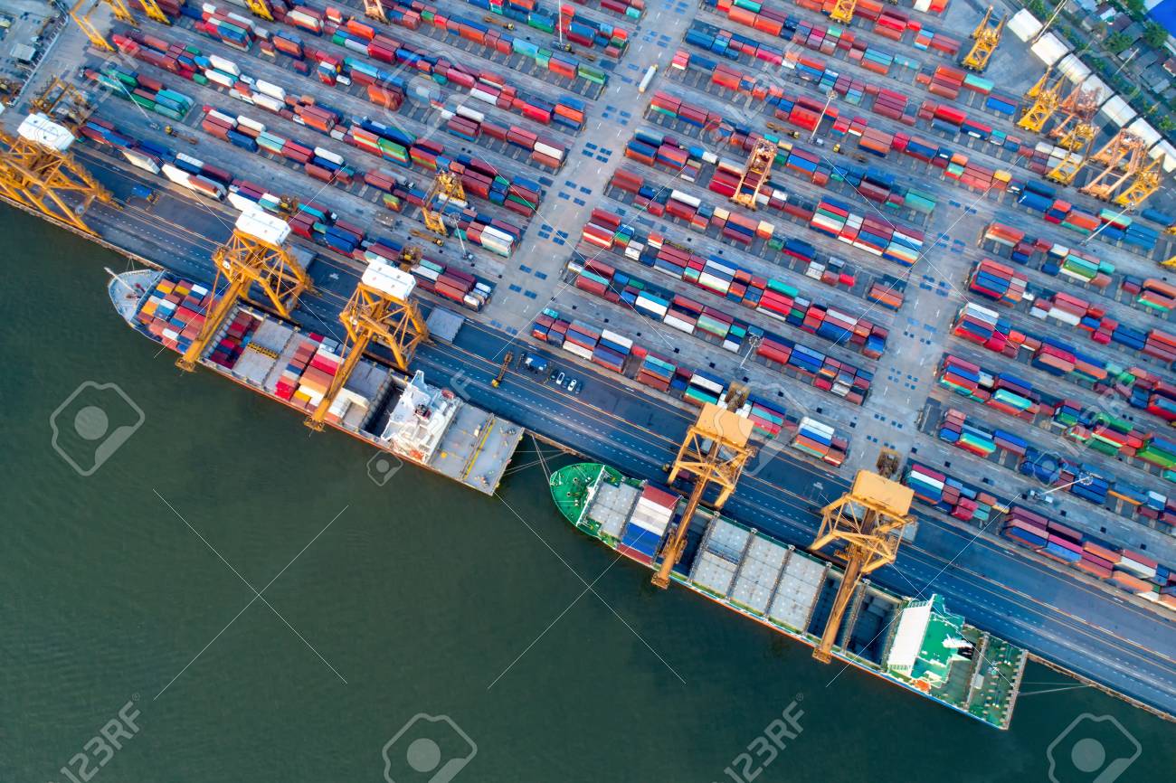 containers yard in port congestion with ship vessels are loading