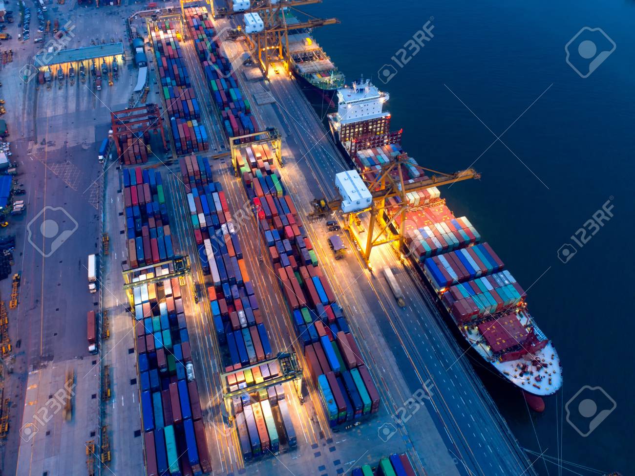 containers yard in port congestion with ship vessels are loading
