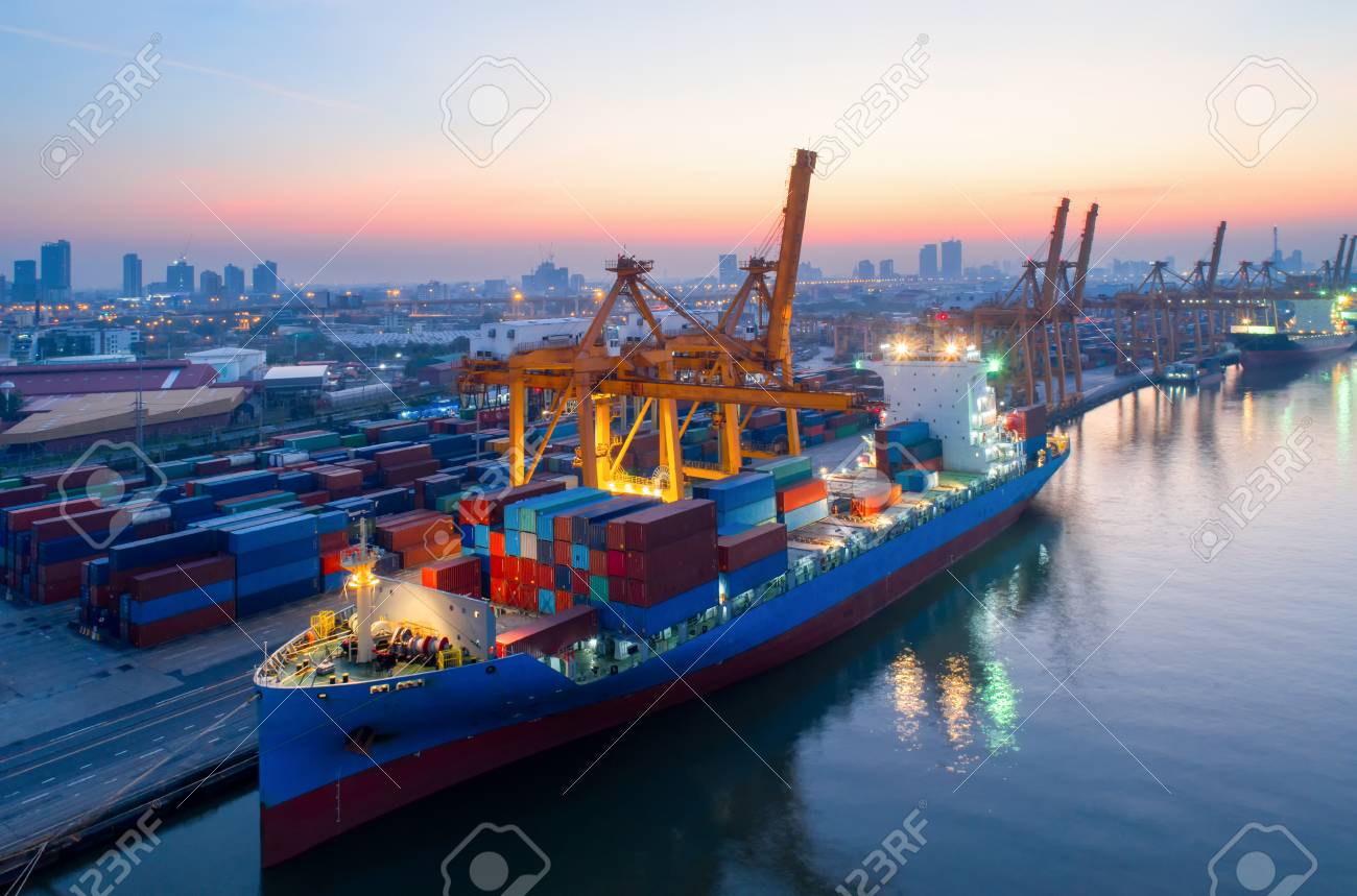 containers yard in port congestion with ship vessels are loading