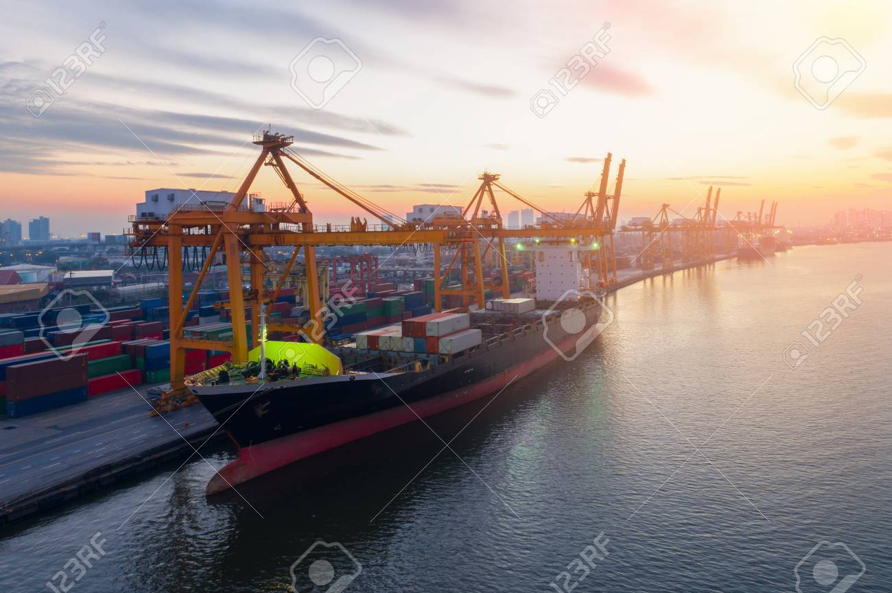 containers yard in port congestion with ship vessels are loading