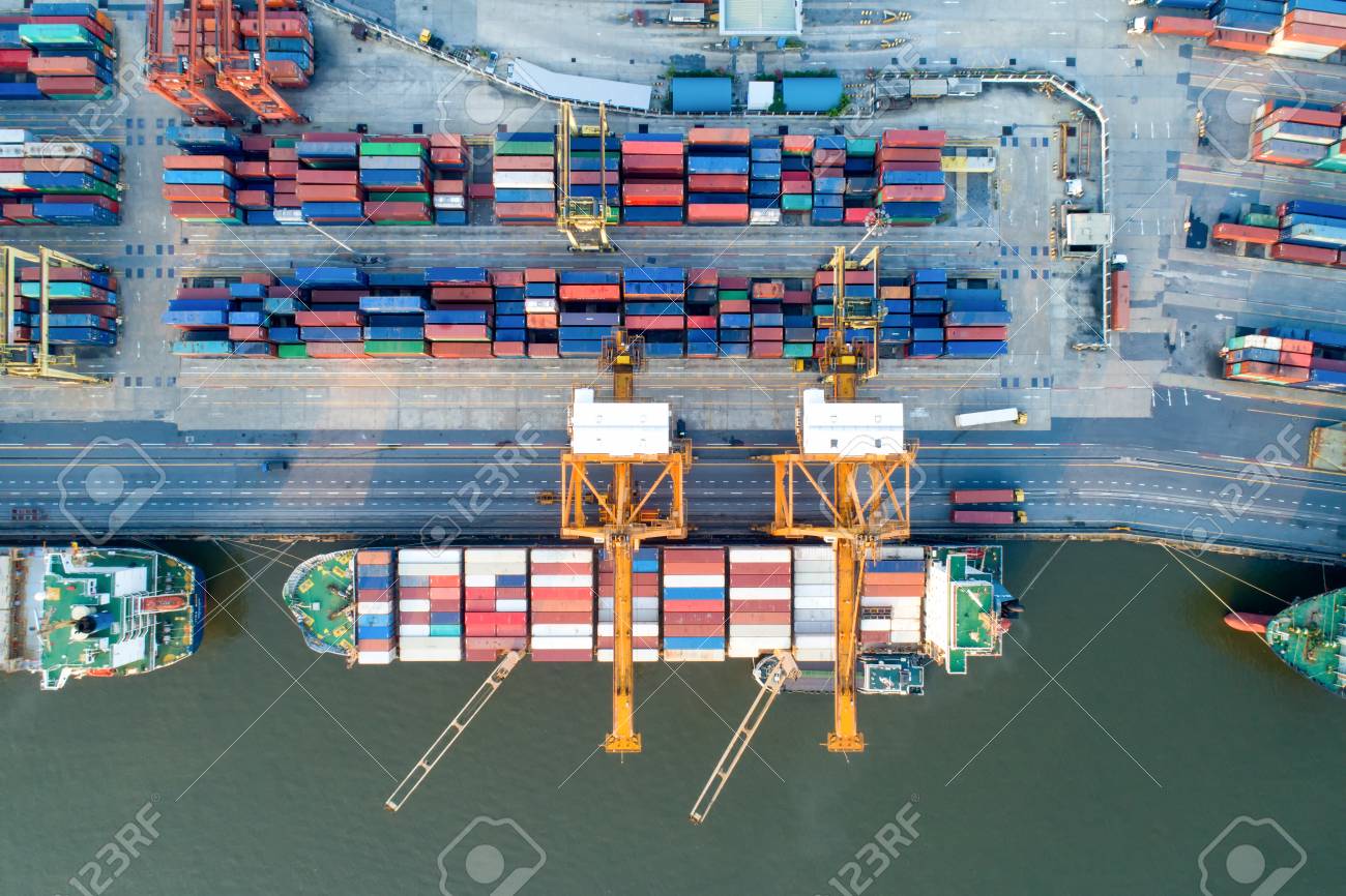 containers yard in port congestion with ship vessels are loading