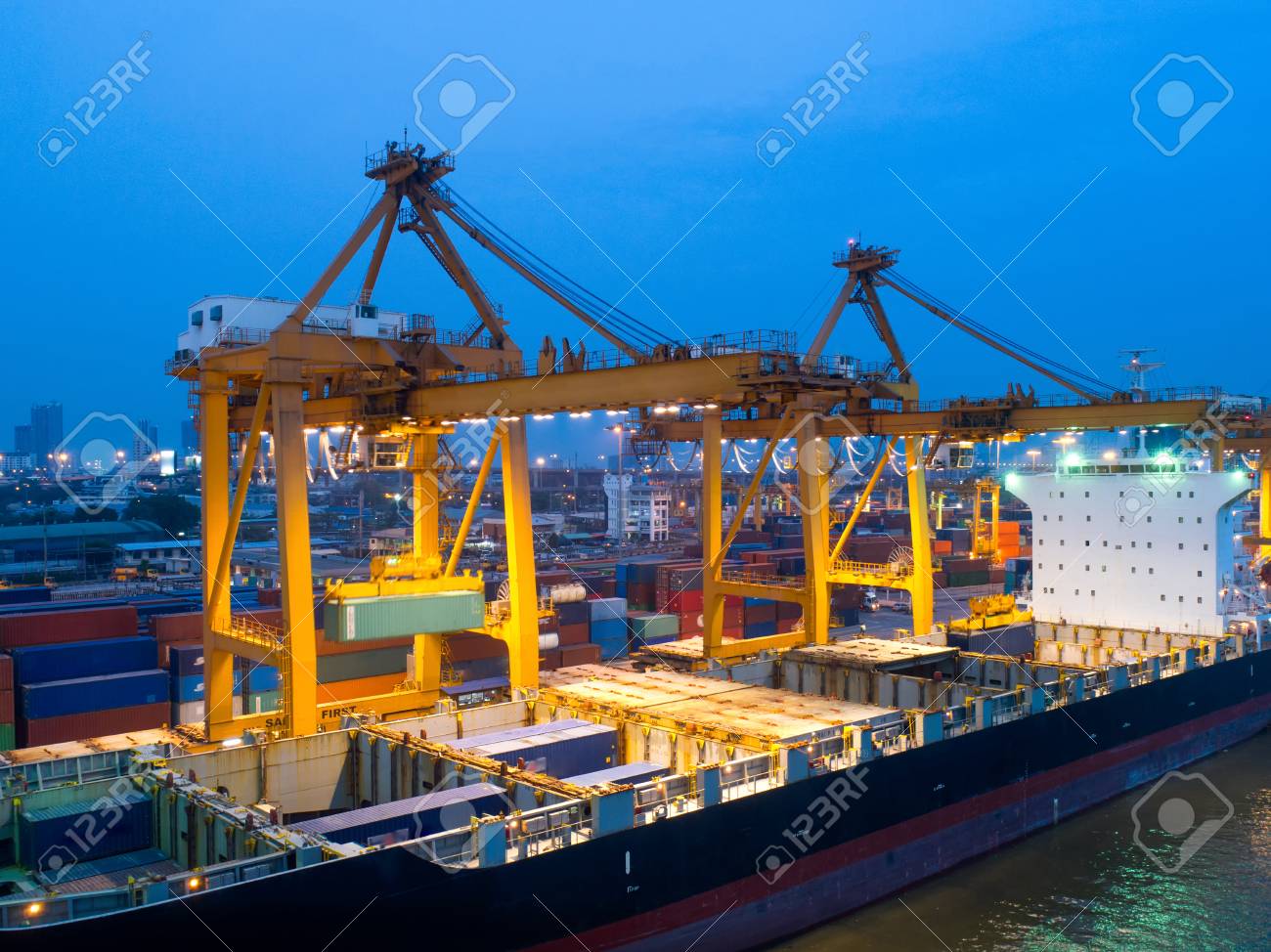 aerial view of containers yard in port congestion with ship vessels