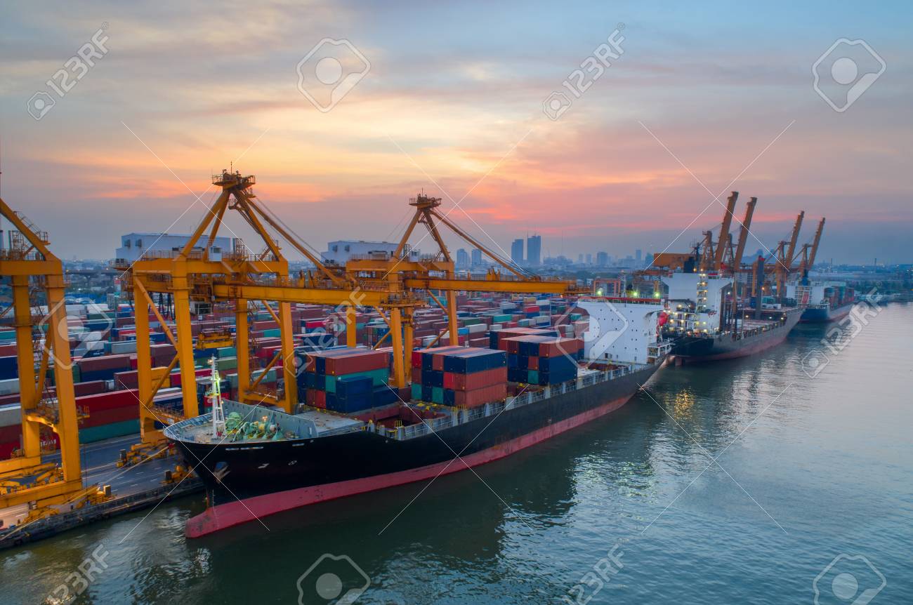 containers yard in port congestion with ship vessels are loading