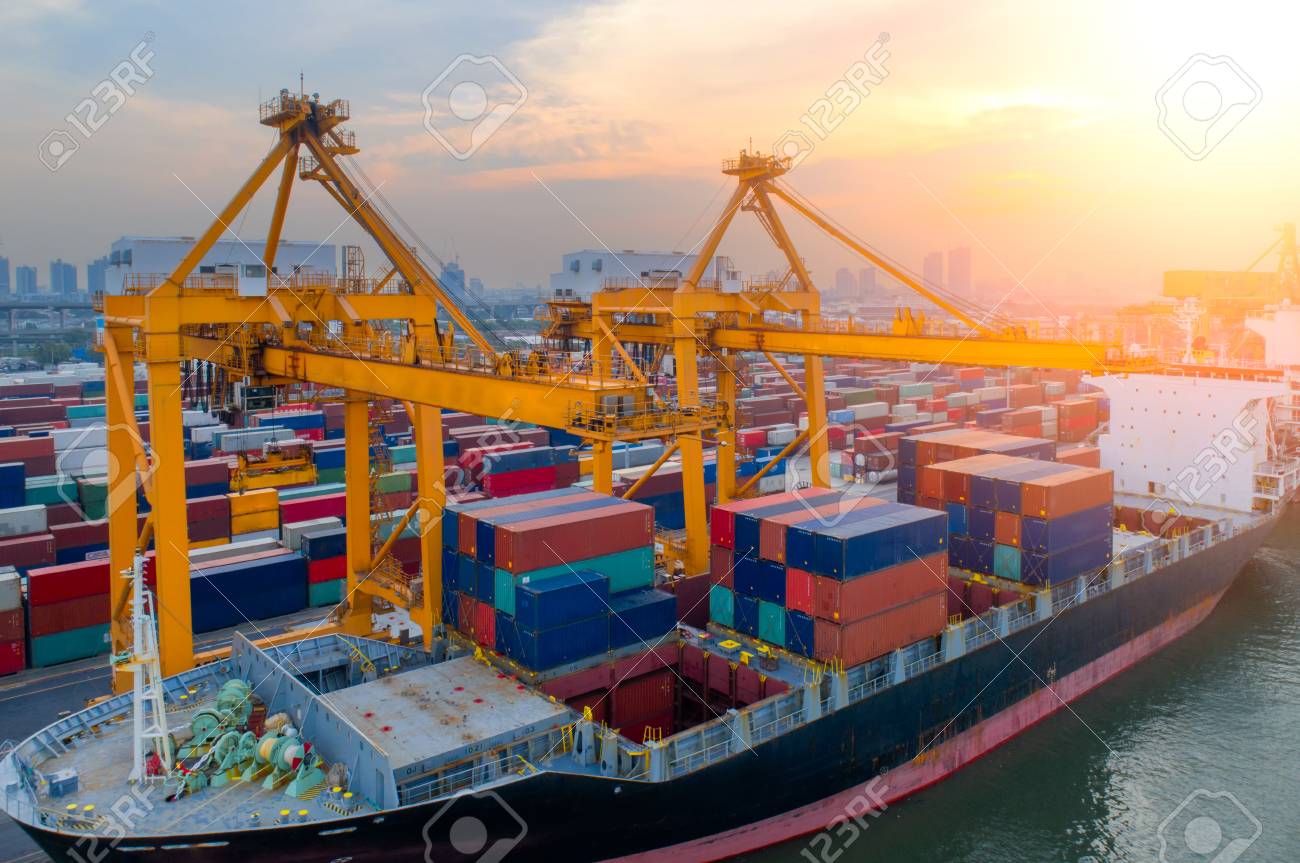 aerial view of containers yard in port congestion with ship vessels