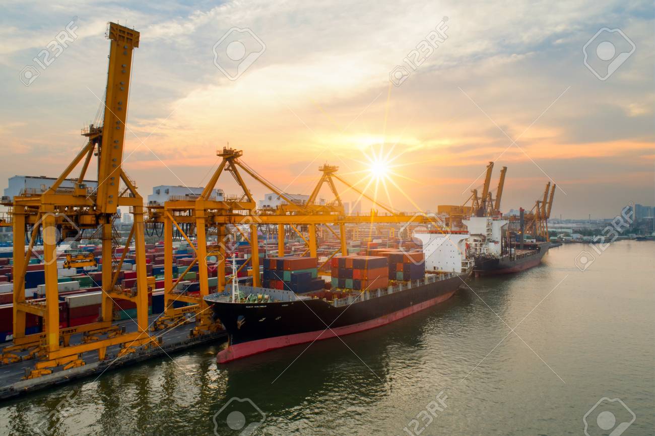 containers yard in port congestion with ship vessels are loading