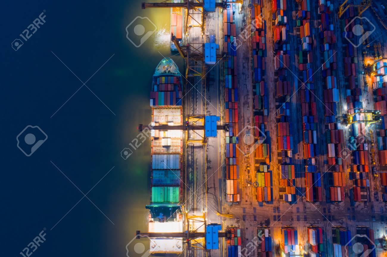 containers yard in port congestion with ship vessels are loading