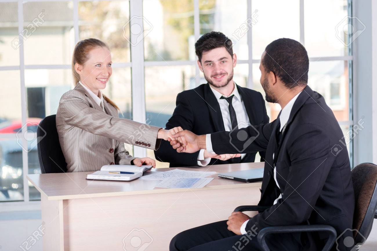 meeting of chiefs three successful business people sitting in