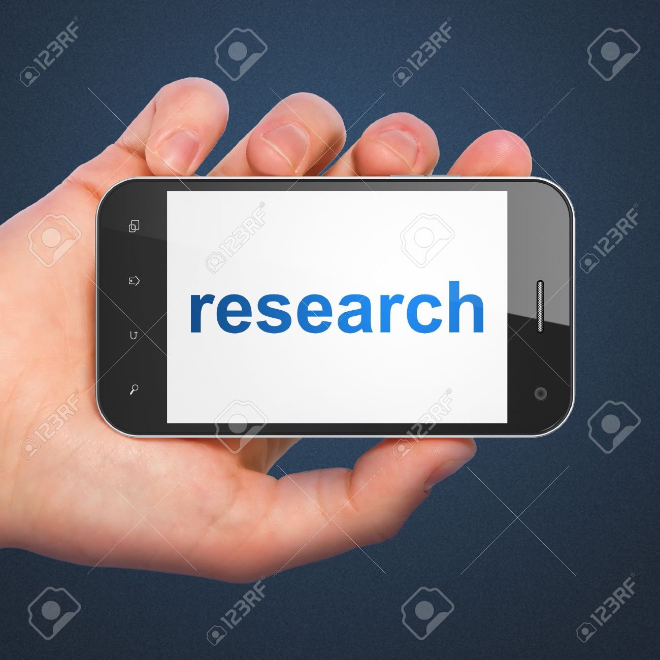marketing concept hand holding smartphone with word research stock