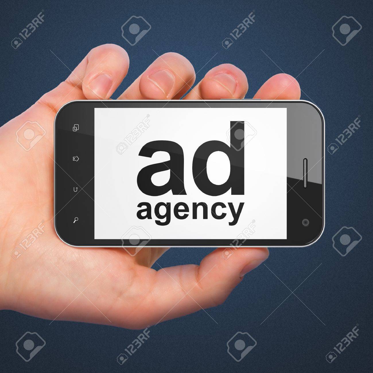 marketing concept hand holding smartphone with word ad agency