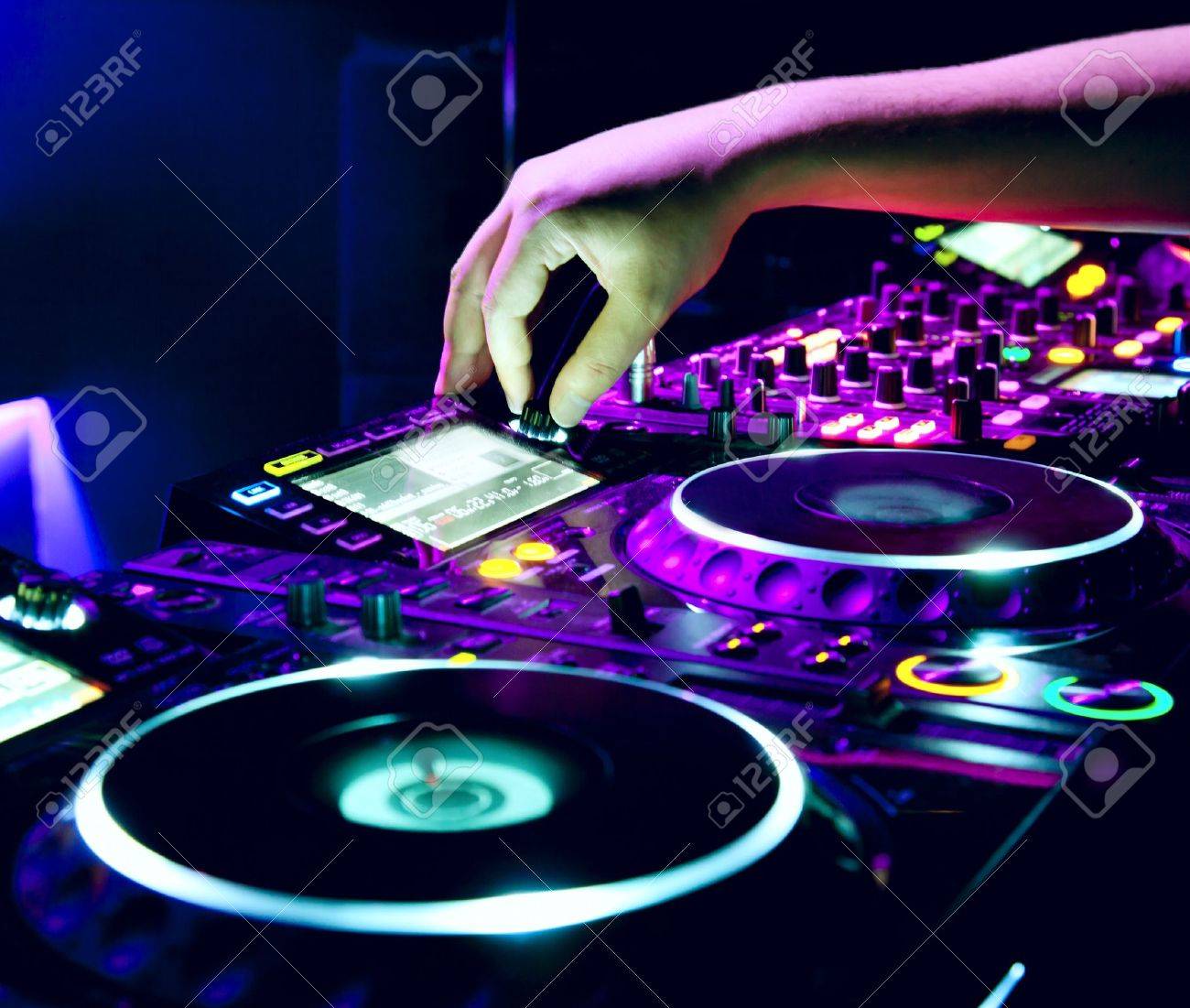 Dj Mixes The Track In The Nightclub At A Party Stock Photo Picture And Royalty Free Image Image