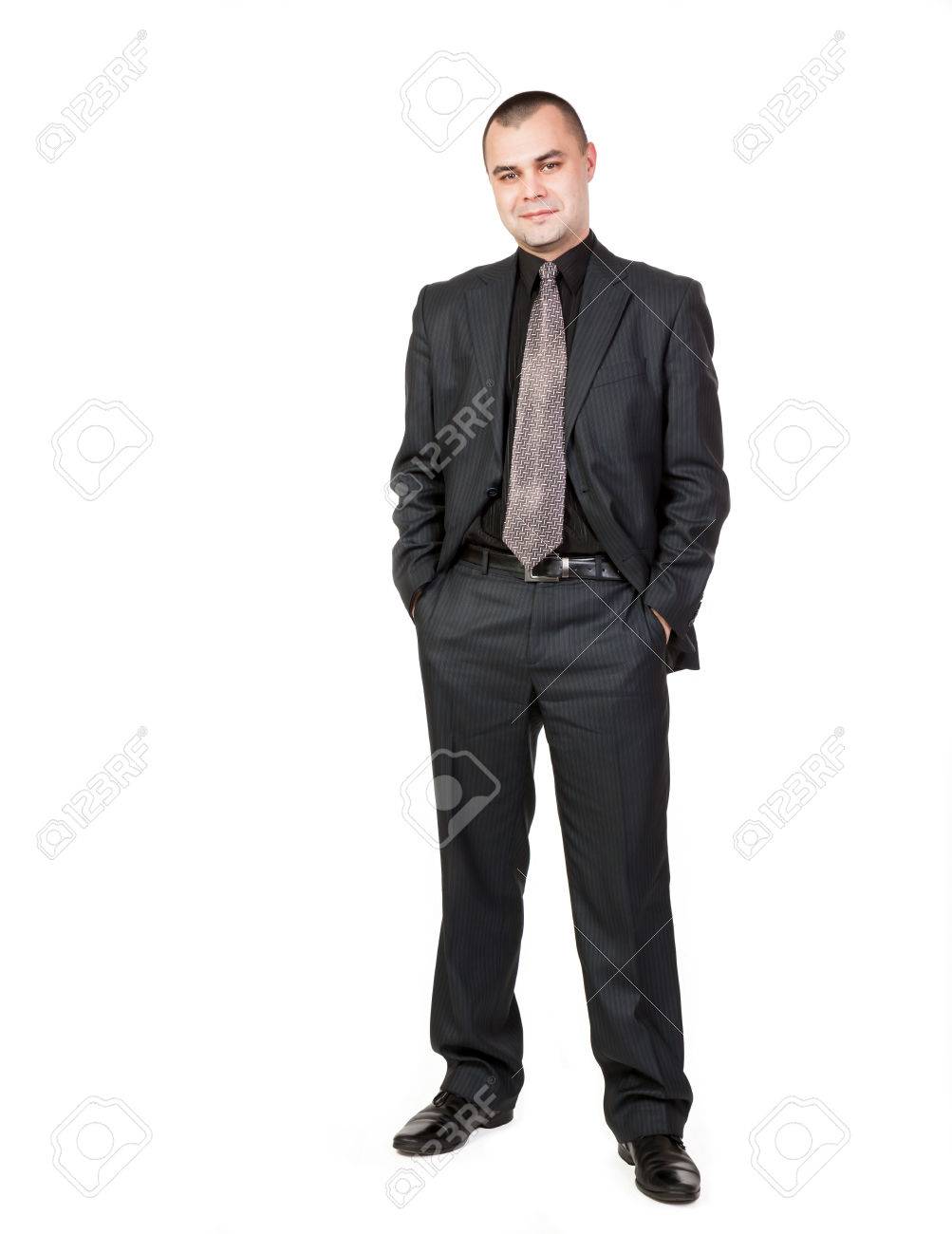 分離の白い背景の上ビジネス ポーズで青年実業家の肖像画 ズボンのポケットに手 の写真素材 画像素材 Image