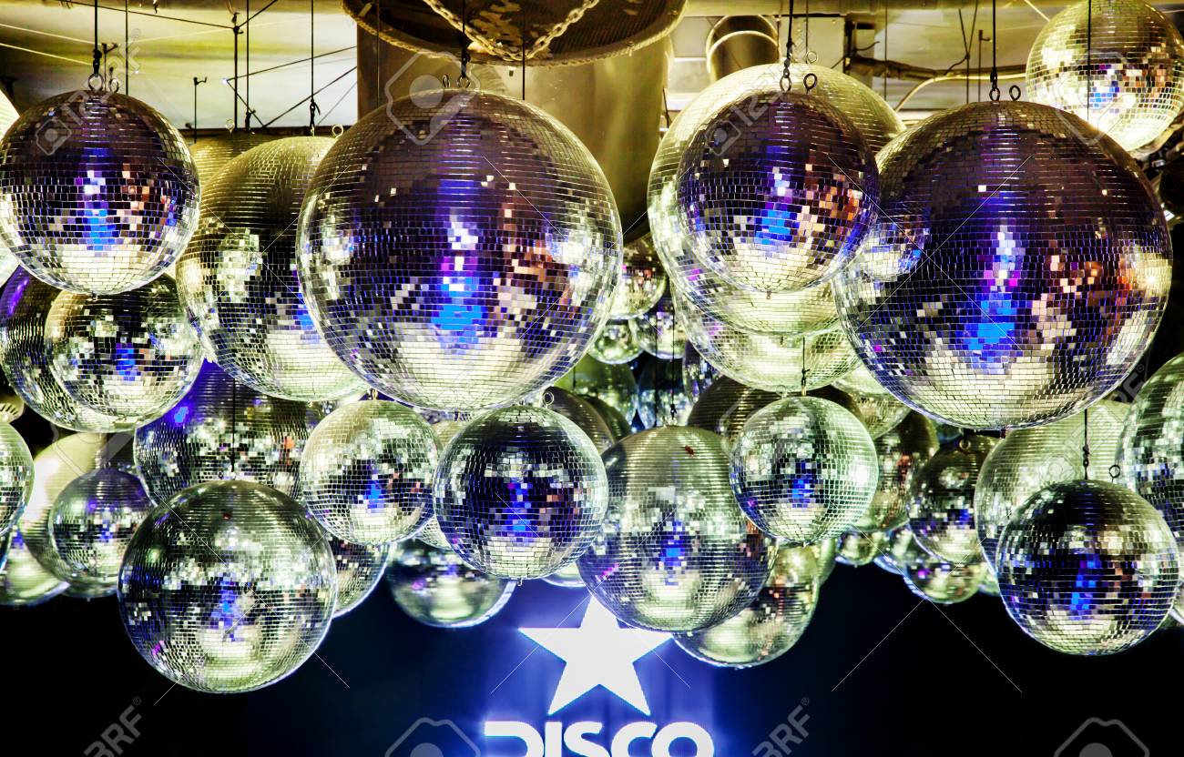 Lots Of Suspended Disco Balls On The Ceiling In Nightclub For Party. Bright Beautiful Rays Of Light Stock Photo, Picture And Royalty Free Image. Image 116005336.