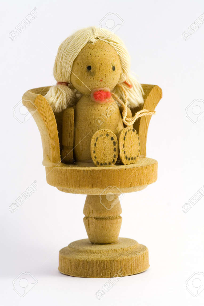 doll sitting in chair