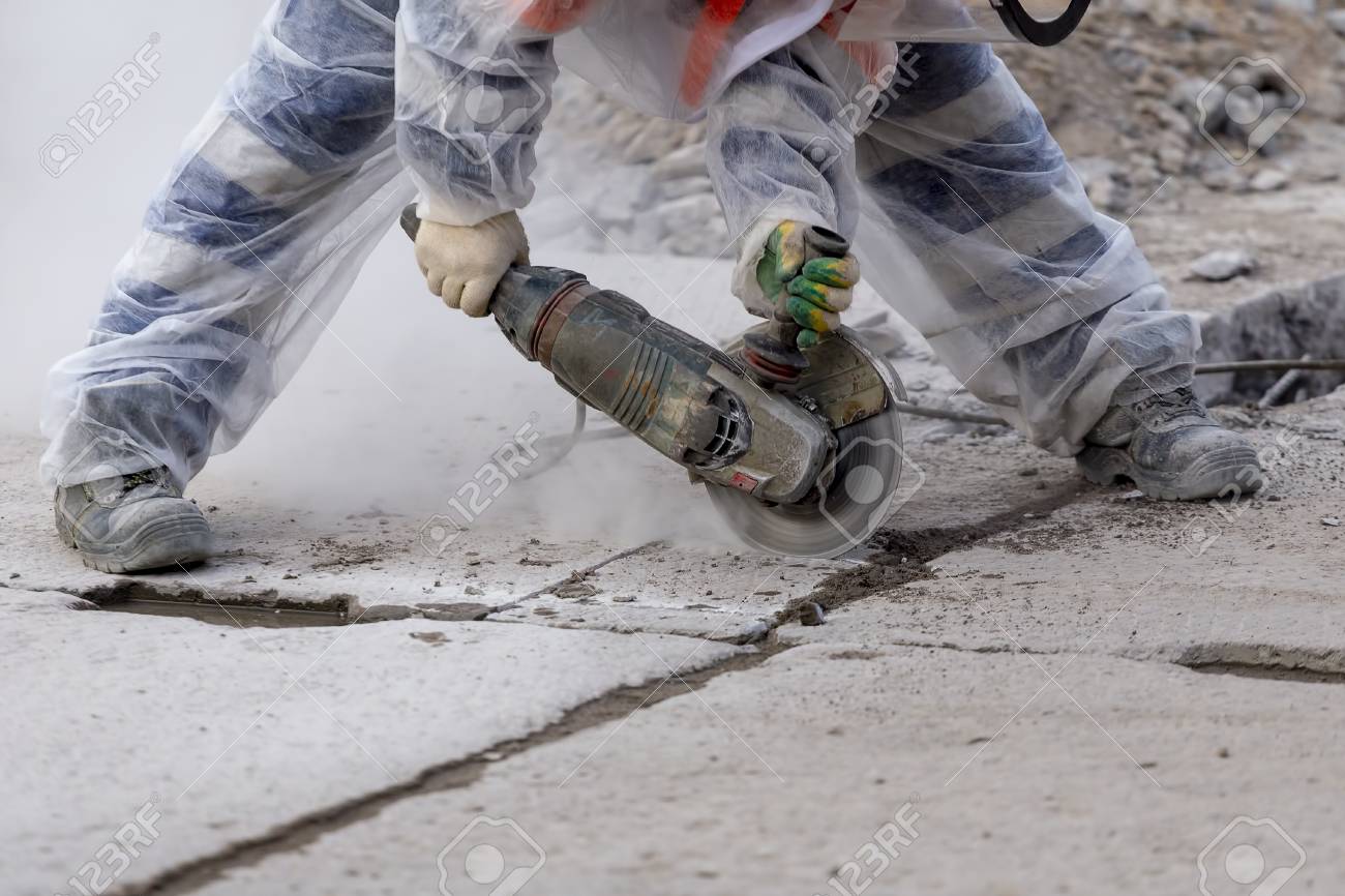 Worker Catching And Using Electric Cutting Machine Tool To Cut