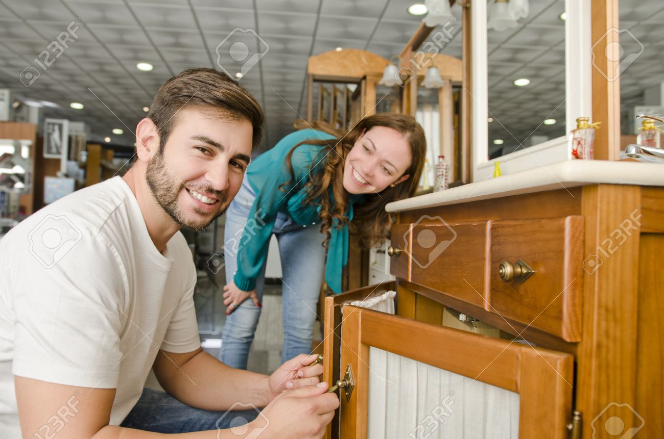 Couple Buying Furniture At Big Plumbing Store Stock Photo Couple Buying Furniture At Big Plumbing Store Stock Photo