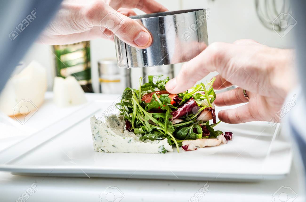 chef at work plating vegetables Stock Photo - 87337322