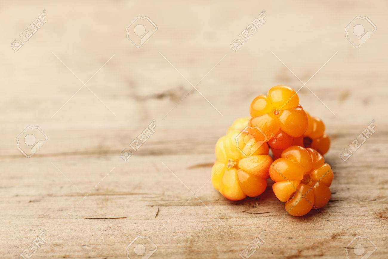 Cloudberries (moroshka) On A Wooden Table. Wild Northern Berry. Shallow  Depth Of Field Stock Photo, Picture and Royalty Free Image. Image 43089095.