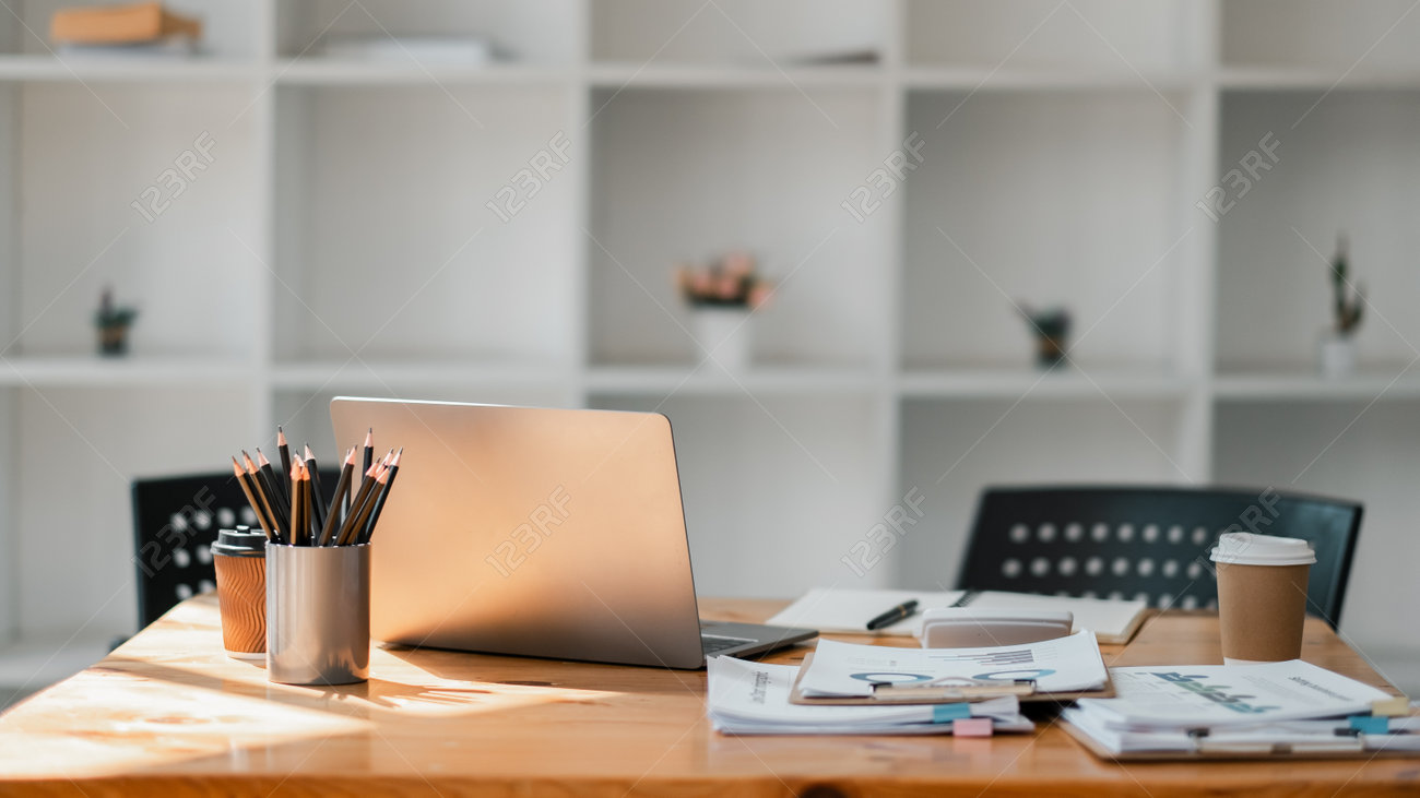 https://previews.123rf.com/images/maxxasatori/maxxasatori2405/maxxasatori240500115/228879576-minimalist-office-desk-setup-featuring-a-sleek-laptop-a-cup-of-coffee-and-neatly-arranged-work.jpg?utm_source=chatgpt.com