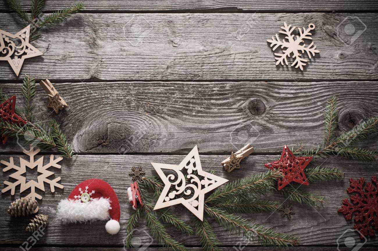 christmas decoration with fir branch on old wooden background foto