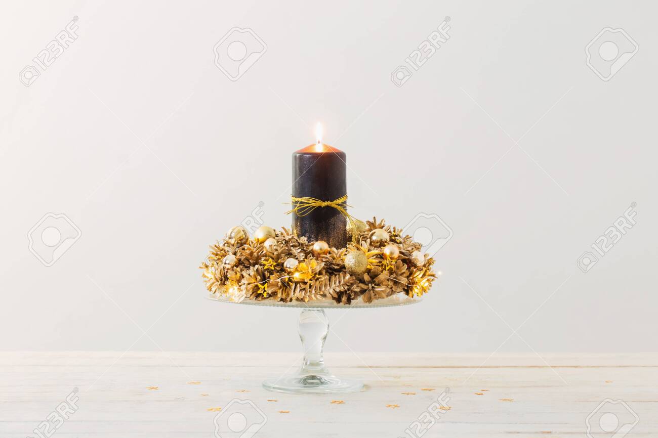 Christmas Golden Wreath With Black Burning Candle On White Background Stock Photo Picture And Royalty Free Image Image 135526288