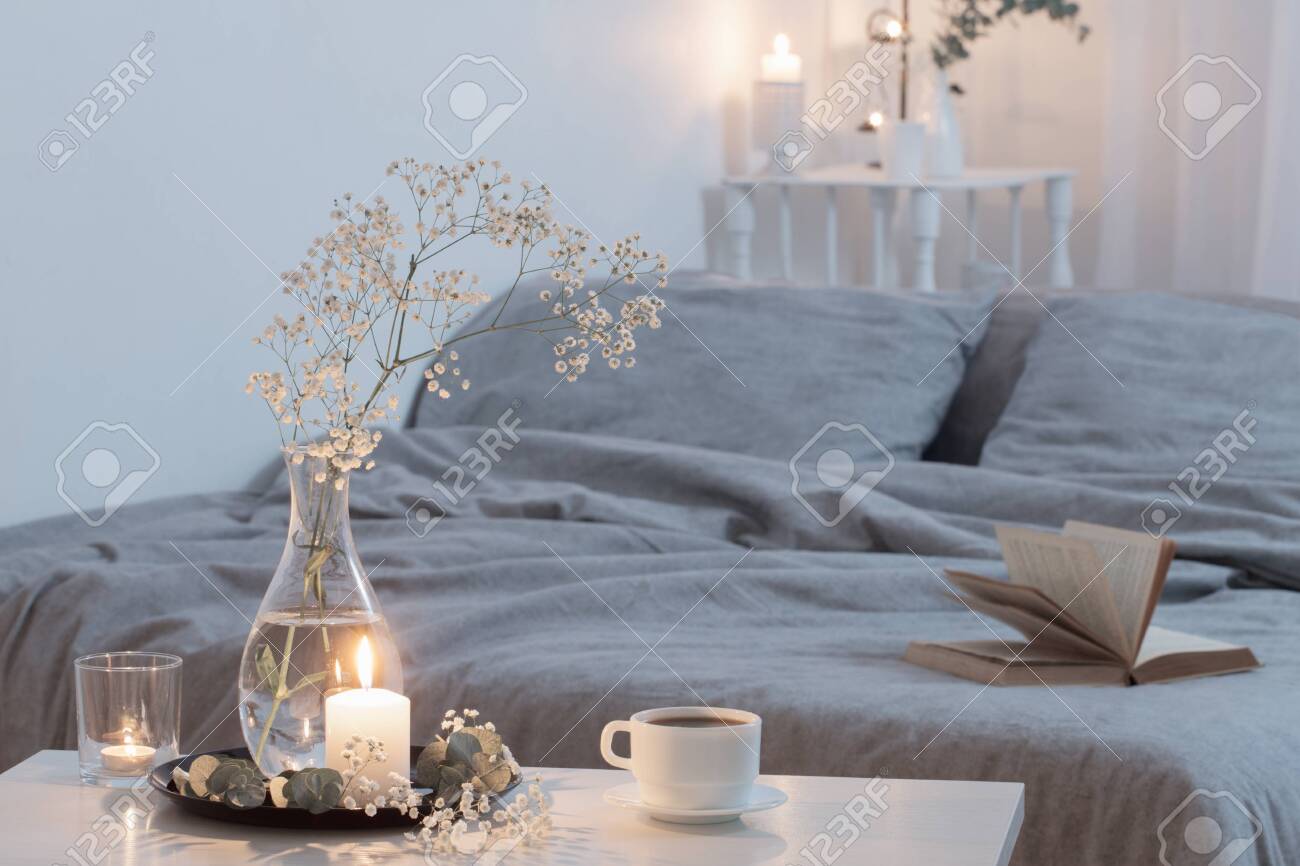 Night Interior Of Bedroom With Flowers And Burning Candles Stock Photo Picture And Royalty Free Image Image 138222453