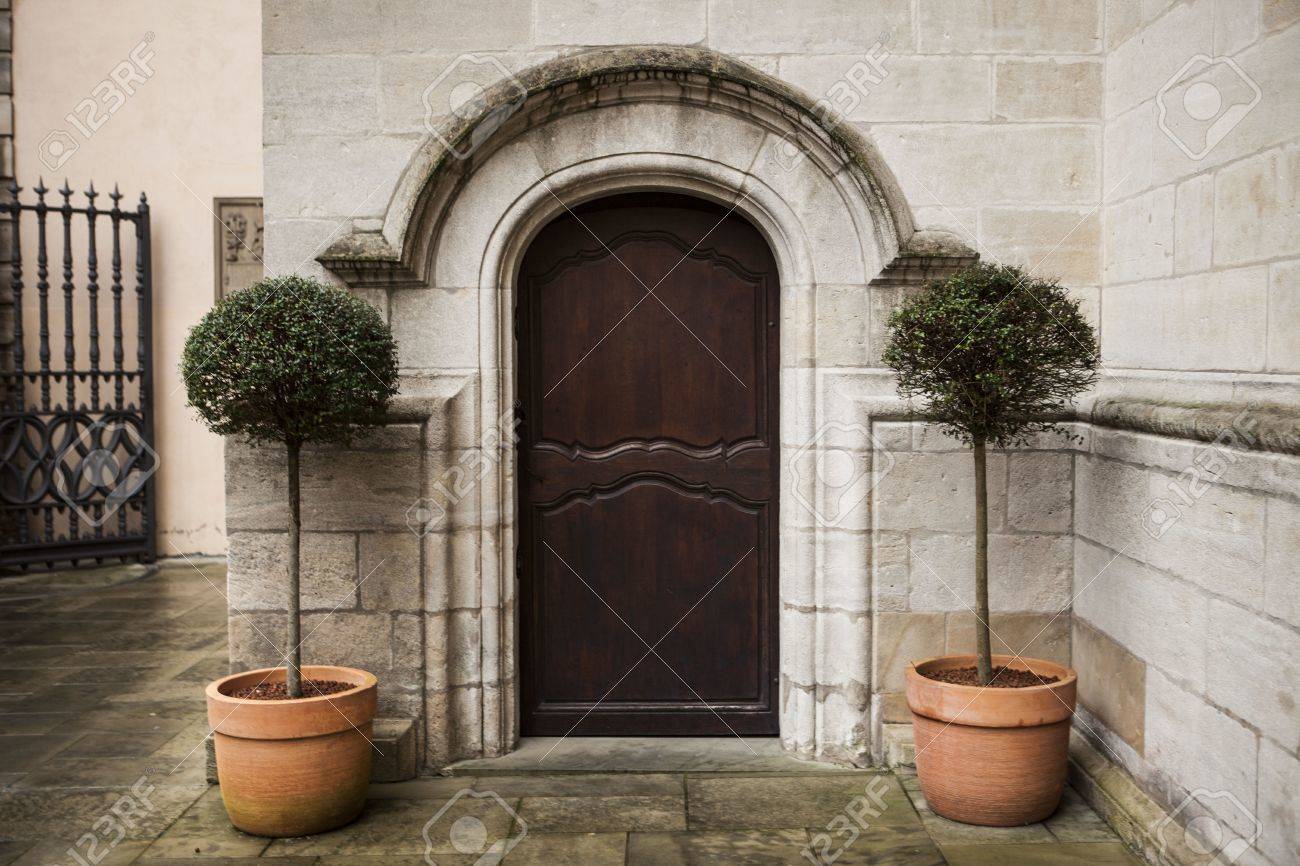 A Large Wooden Door Closed An Old Fortress In The Stone Wall.. Stock ... A Large Wooden Door Closed An Old Fortress In The Stone Wall.. Stock ...
