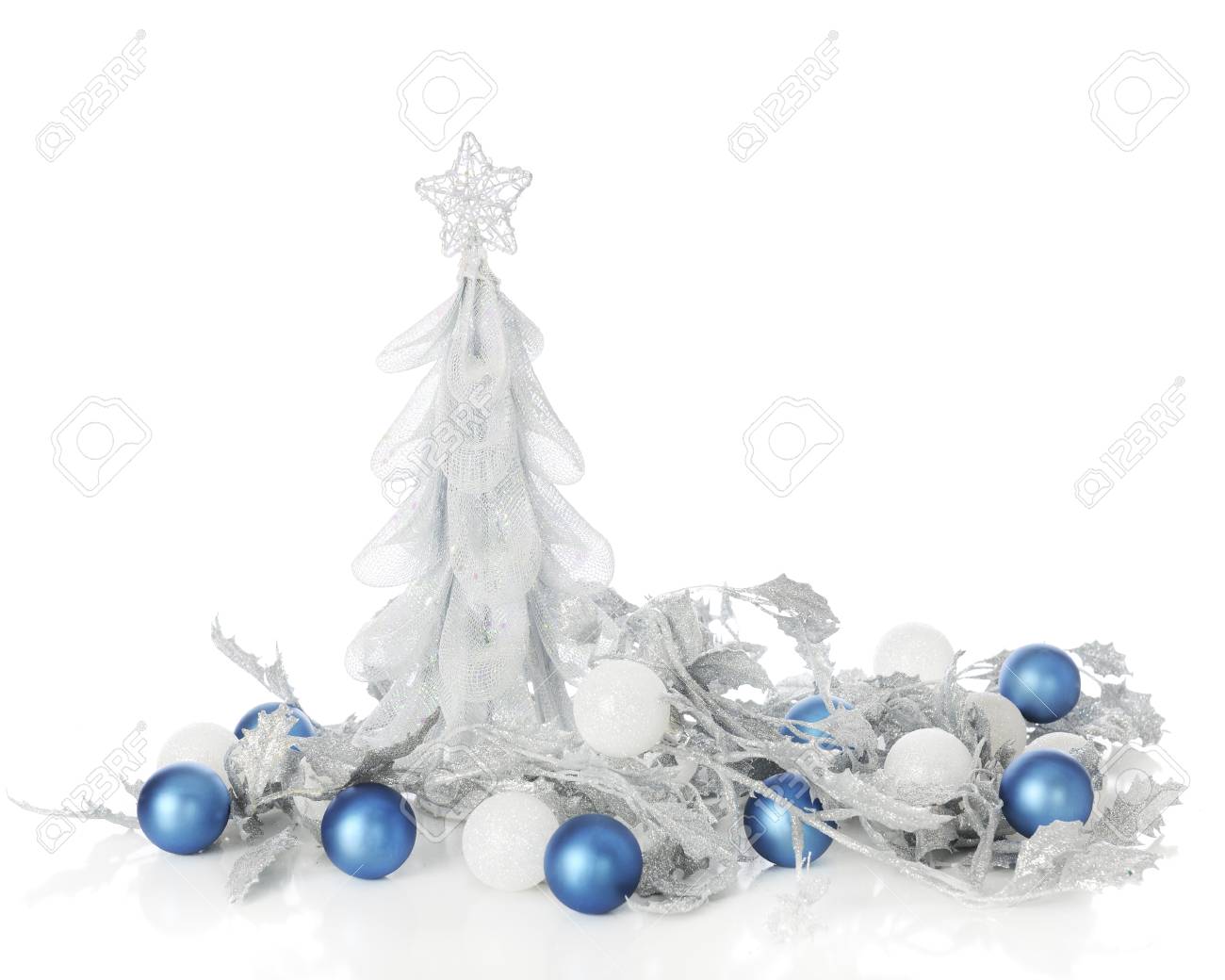 a simulated silver christmas tree surrounded by sparkly silver leaves blue and frosty white ornaments - Frosty Blue Christmas Decorations a simulated silver christmas tree surrounded by sparkly silver leaves blue and frosty white ornaments - Frosty Blue Christmas Decorations