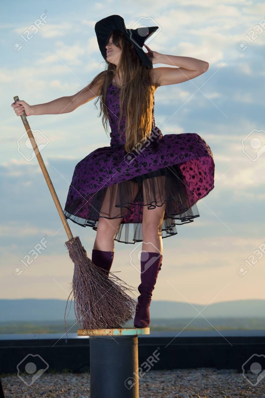 pretty witch with hat and broom stock photo picture and royalty