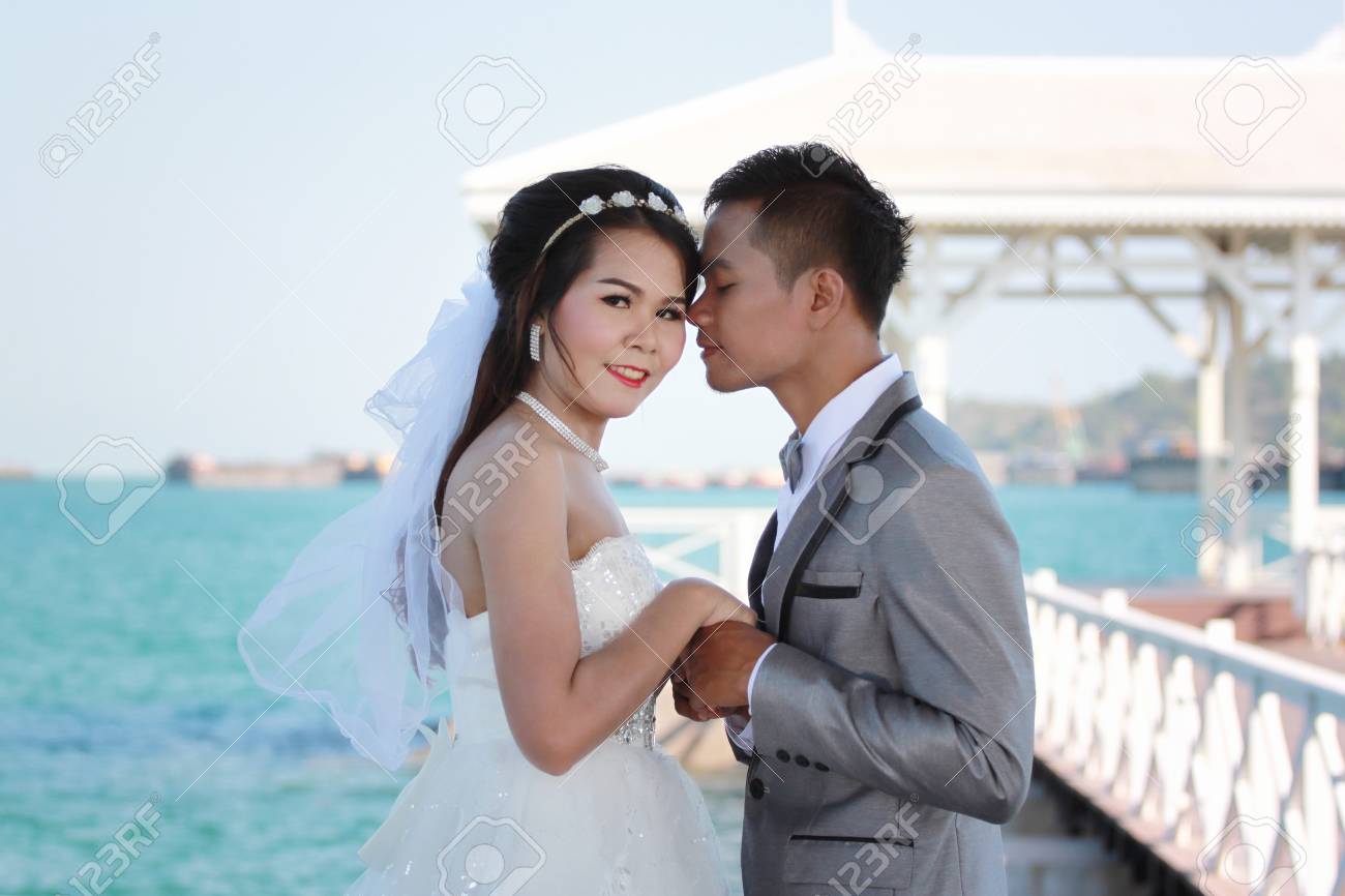 Asian Couples In Outdoor Pre Wedding Photography Locations Seaside Stock Photo Picture And Royalty Free Image Image 83955719