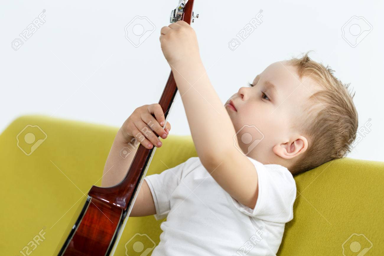 Small four stringed guitar deals