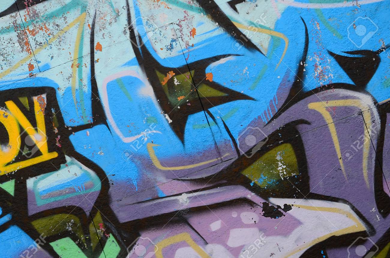 fragment of graffiti drawings the old wall decorated with paint grafiti drawings