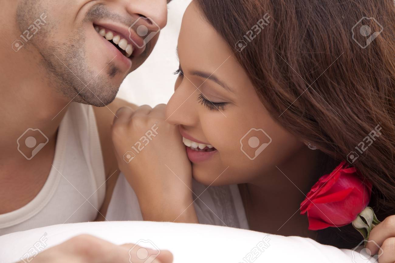 couple romancing in bed stock photo picture and royalty free image