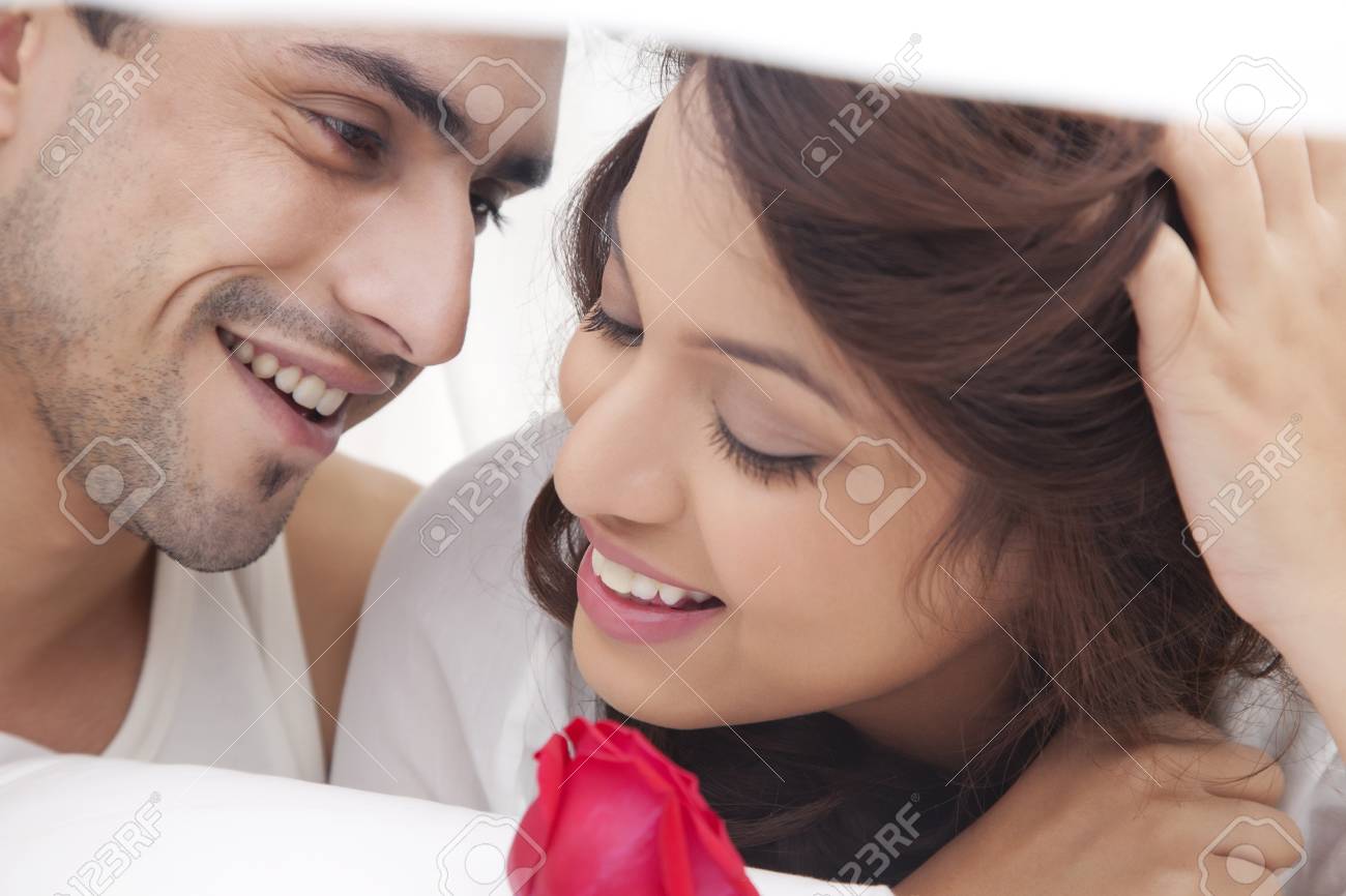 close up of couple romancing in bed stock photo picture and royalty
