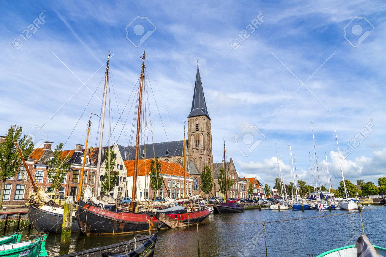 HARLINGEN, NETHERLANDS - AUG 18, 2014: pier with old boats in Harlingen, Netherlands. Harlingen became town in 1234 and is also called Venice of Netherlands. - 35782096 HARLINGEN, NETHERLANDS - AUG 18, 2014: pier with old boats in Harlingen, Netherlands. Harlingen became town in 1234 and is also called Venice of Netherlands. - 35782096